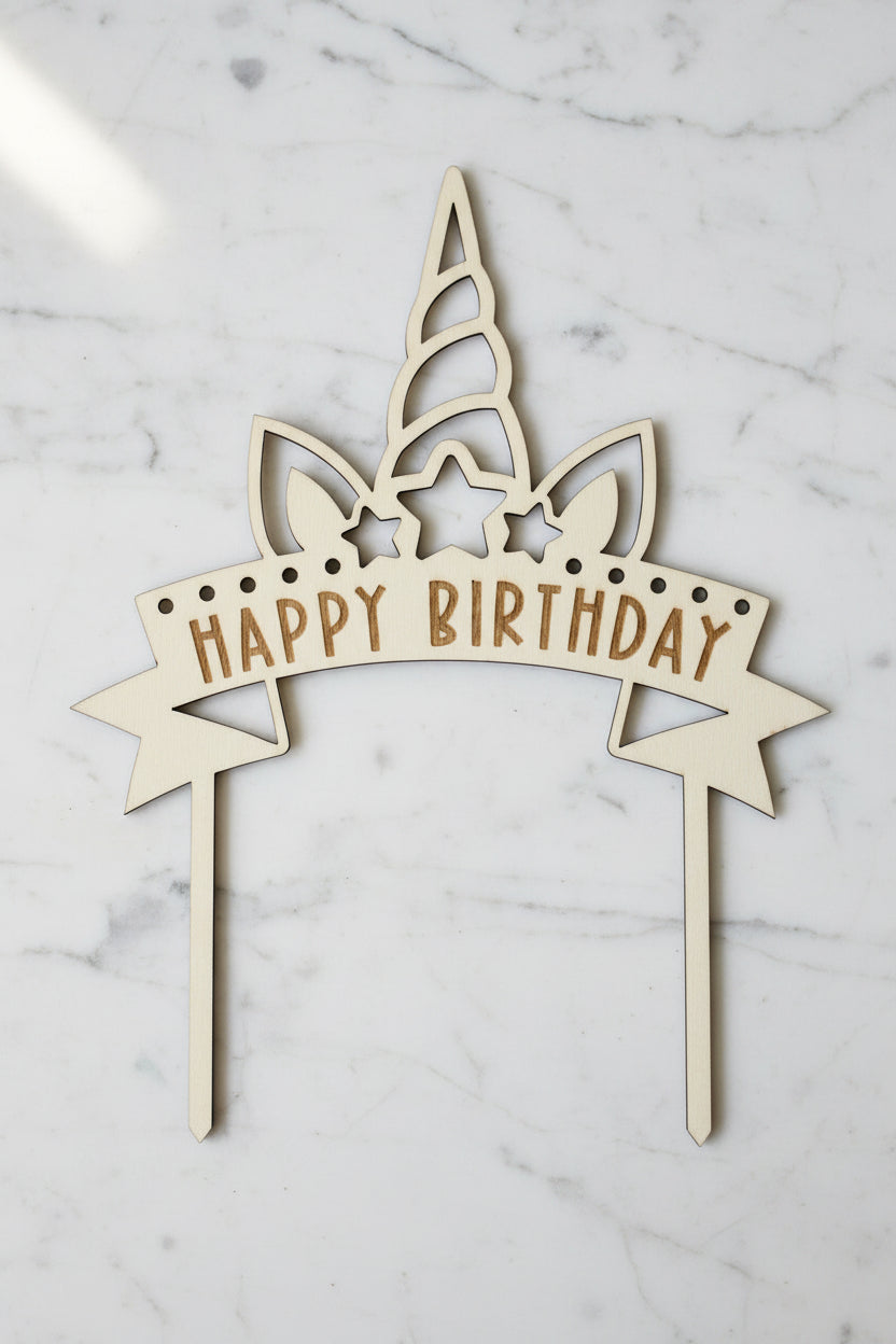 Unicorn themed Wooden birthday cake topper with 'Happy Birthday' text on a white background