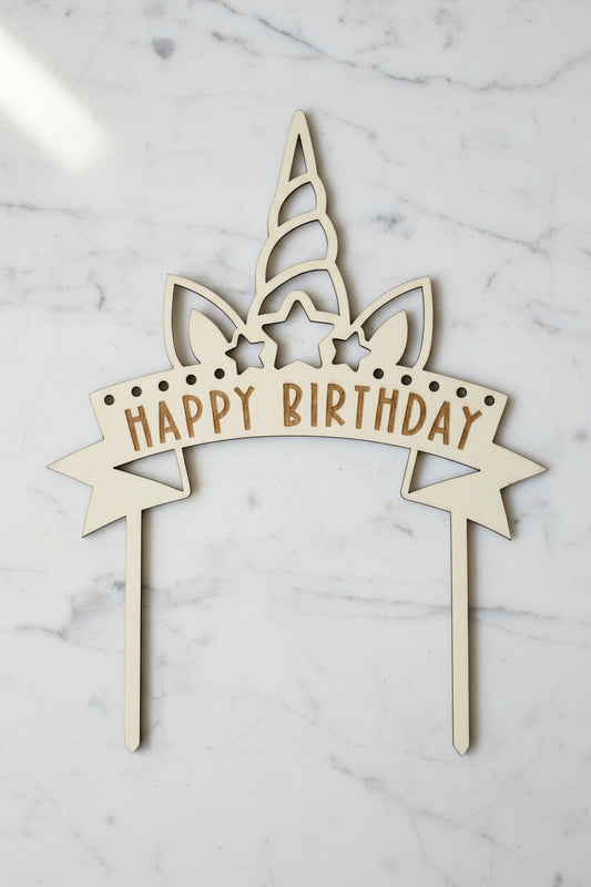 Unicorn themed Wooden birthday cake topper with 'Happy Birthday' text on a white background